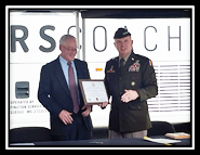 GEN Paul E. Funk II, Commanding General of TRADOC presenting the Certificate of Participation to John Castle, President and CEO of Mears Transportation