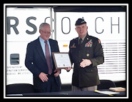 GEN Paul E. Funk II, Commanding General of TRADOC presenting the Certificate of Participation to John Castle, President and CEO of Mears Transportation GEN Paul E. Funk II, Commanding General of TRADOC presenting the Certificate of Participation to John Castle, President and CEO of Mears Transportation