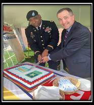 Mr. Chris Steiner, Vice President Sales, Bimbo Bakeries USA and LTC Dion Hall, Commander, Mid-Atlantic Recruiting Battalion cut the Ceremonial Cake