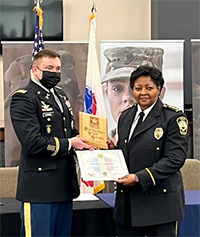 LTC David Hensel, Commander, Atlanta Recruiting Battalion handing the Army PaYS plaque to Chief Denise Downer-McKinney, Chief of Police 