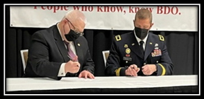 Ben Craig, Executive Vice President, Northrim Bank and BG Charles Knowles, Assistant, Adjutant General AKARNG signing the Memorandum Presenting the PaYS Plaque to Sheriff Chuck Wright, Spartanburg County Sheriff