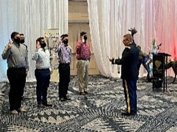 LTC Russell Clark, Commander, Texas Army National Guard Recruiting Battalion administers the Oath of Enlistment