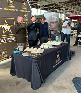 GEN Funk, Aidan Camran and Daniel Beyer cut the ceremonial cake.