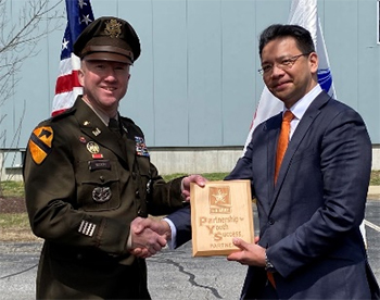 CPT Derek J. Bisson, Commander, New Hampshire Recruiting Company presented Mr. Victor Leviste, Vice President, Strategy & Business Development, CAES the PaYS Plaque