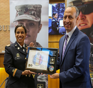 LTC Adriana Ramirez-Scott, Commander, San Antonio Army Recruiting Battalion and Mayor Ramiro Garza Jr., City of Edinburg pose with the PaYS Certificate of Participation.