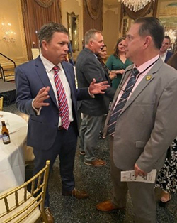 Michael O'Brien (right), PaYS Marketer, discussing the program with Brian Hayes, Jr., Vice President, Redbird Carriers at the Industry Leaders Forum.