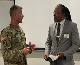 1SG Jason Riley, Mississippi Army National Guard RRB and PaYS Marketing Analyst Samuel Armstrong discuss PaYS and connecting Soldiers with partners while at the RSP.