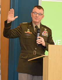 GEN Paul E Funk II, Commanding General, TRADOC administers the Oath of Enlistment to four Future Soldiers.