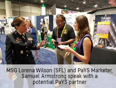 MSG Lorena Wilson (SFL) and PaYS Marketer, Samuel Armstrong speak with a potential PaYS partner MSG Lorena Wilson (SFL) and PaYS Marketer, Samuel Armstrong speak with a potential PaYS partner