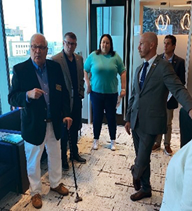 Army Reserve Ambassador Douglas Gilbert (left) addresses several members of the Yellow Corporation team at the PaYS Signing Ceremony. 