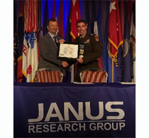 MG Paul Stanton, Commanding General, Cyber Center of Excellence and Fort Gordon presented Mr. John Dewey, CEO, Janus Research Group the PaYS Certificate of Participation plaque from Army PaYS