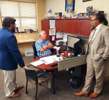 (l-r) Travis Carter, Michael Lewis and Samuel Armstrong discussing PaYS Program benefits.