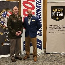 BG Richard Wilson, Commanding General, GAARNG, and Xavier Cugnon, VP of Human Resources, Arrow Exterminator, Inc. (Parent Brand) pose for photos after the signing ceremony.