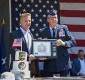 Mr. Trey Mytty, CEO, Truck Center Companies and MG Daryl Bohac, Adjutant General, Nebraska National Guard, sign the Ceremonial Agreement Form and pose with the PaYS Certificate of Participation Plaque. Mr. Trey Mytty, CEO, Truck Center Companies and MG Daryl Bohac, Adjutant General, Nebraska National Guard, sign the Ceremonial Agreement Form and pose with the PaYS Certificate of Participation Plaque.