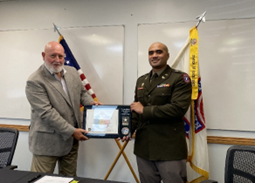Mr. Martin Kozarec, Vice President Sales and Marketing, Ironform and CPT Taumaloto To'o, Commander, Mid-Missouri Company pose with the PaYS Certificate of Participation Plaque.