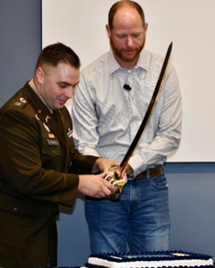 CPT Micah Robbins, Commander, Liberty Recruiting Company and Mr. David Burkhart, Vice President, Garney Construction cut the PaYS Ceremonial Cake celebrating the partnership.