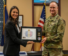LTC David Jurva presents Maria Bourne the Certificate of Participation for the PaYS program to the newest partner Denali Universal Services.