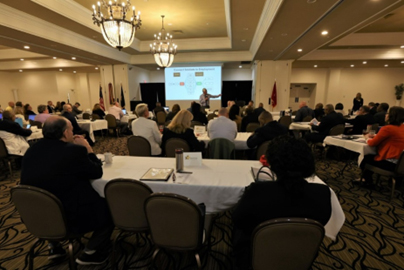 Walter Herd, Director, TAP, provides opening remarks during the symposium