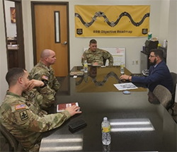 Travis Carter briefing the AZARNG RRB Command team about PaYS Program. 