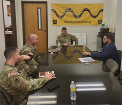 Travis Carter briefing the AZARNG RRB Command team about PaYS Program. Travis Carter briefing the AZARNG RRB Command team about PaYS Program.