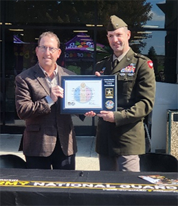 Jeffrey McMahon, CFO, Good Foods Group, LLC receives the PaYS Certificate of Participation Plaque from BG Matthew Strub, Deputy Adjutant General, WIARNG. 
