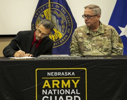 Michael Walkowiak, SHRBP, Molex, LLC signs the PaYS Ceremonial Agreement. Michael Walkowiak, SHRBP, Molex, LLC signs the PaYS Ceremonial Agreement.