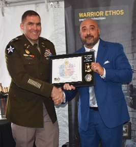 LTC Heffner, Commander, Great Lakes Recruiting Battalion and Rudy Patros, CEO, Securatech pose with the PaYS Certificate of Participation Plaque after the ceremony.