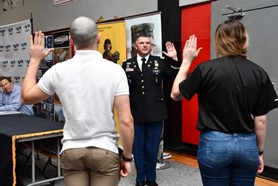 LTC Norton administering the Oath of Enlistment to two Army Future Soldiers during the BCH Mechanical PaYS Signing Ceremony. LTC Norton administering the Oath of Enlistment to two Army Future Soldiers during the BCH Mechanical PaYS Signing Ceremony.