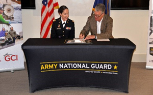 (l-r) Captain Jessica Fernandez and Mr. Joseph “Joe” Wahl sign the ceremonial PaYS Memorandum of Agreement