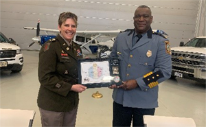 (l-r) COL Rieke presents the Ceremonial Plaque to Chief English. 