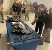 COL Rieke and Chief English cut the cake with the traditional saber. COL Rieke and Chief English cut the cake with the traditional saber.