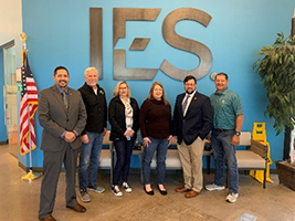 (l-r) Mr. Gill, Mr. Lloyd Songne (Recruiter), Ms. Chris Dunblazier (Recruiting Manager), Ms. Katy Landis (HR Director), Mr. Carter, and Tom Emma (President IES Communications) pose for a picture after receiving a PaYS briefing from the Marketers.