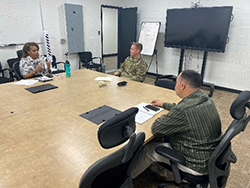 Ms. Ross discussing the Army PaYS Program with LTC Hindert and Mr. Sanjurjo on techniques to strengthen the PaYS Partnership. Ms. Ross discussing the Army PaYS Program with LTC Hindert and Mr. Sanjurjo on techniques to strengthen the PaYS Partnership.
