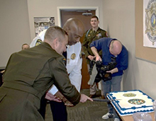 LTC Brian Meister, Commander, Columbia Recruiting Battalion and Sheriff Quentin Miller, Sheriff, Buncombe County Sheriff's Office, cut the ceremonial cake during the PaYS Signing Ceremony welcoming Buncombe County Sheriff's Office to the PaYS Program.