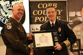 BG Gentry presents Chief VanHoozer a plaque on behalf of the Army PaYS Program.