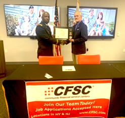 (l-r) MAJ Kelcey Epps presents the PaYS Ceremonial Plaque to Mr. Larry Liskiewicz, Chief Operations Officer of Community Financial Service Centers.