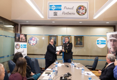 (l-r) Mr. Sedler accepts the PaYS Ceremonial Plaque from LTC Gambacorta to solidify the partnership.