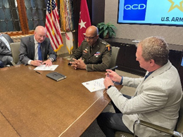 (l-r) Tim Crane, President, Wintrust Financial Corp., GEN Gary Brito, Commanding General, TRADOC, and Roger Prahl, General Manager Quality Custom Distribution sign the agreement for partnership.