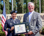 LTC Ramirez-Scott presents the ceremonial PaYS Plaque to Mr. Winrich after signing the Memorandum of Agreement, finalizing the partnership.