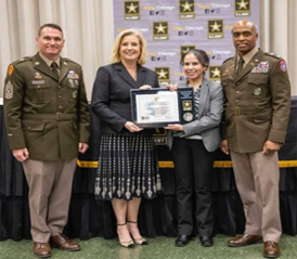 (l-r) CSM Jason Peterson, Command Sergeant Major, Chicago Recruiting Battalion, Hon. Wormuth, Veronica Alanis, Chief Operating Officer, Chicago Transit Authority, and LTC Shane Doolan, Commander, Chicago Recruiting Battalion, pose with the PaYS Ceremonial Plaque.