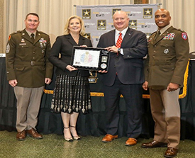 (l-r) CSM Peterson, Hon. Wormuth, Darin Kempke, Assurance Office Managing Partner, BDO, and LTC Doolan proudly poses with the PaYS Ceremonial Plaque.