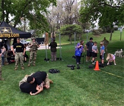 Recruiters from the Omaha Recruiting Company display combatives techniques for those in attendance at the Meet Your Army event.