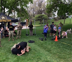 Recruiters from the Omaha Recruiting Company display combatives techniques for those in attendance at the Meet Your Army event. Recruiters from the Omaha Recruiting Company display combatives techniques for those in attendance at the Meet Your Army event.