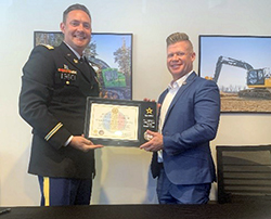 (l-r) CPT Andrew Doyle and Mr. Driscollo holding the PaYS Certificate of Participation.