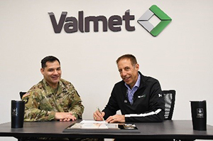 MAJ Michael Durham and Michael Hoffman sign the ceremonial agreement.