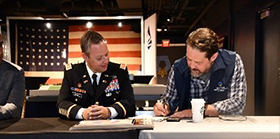 (l-r) LTC Harrell and Mr. Sweigart sign the ceremonial memorandum of agreement.