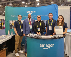 Antonio Johnson (center left) and MSG Lorena Wilson (center) pose with partners from Amazon. 