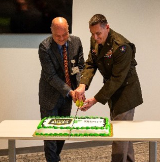 Mr. Wilson and BG Erickson cut the cake at the reception following the PaYS Signing Ceremony. Mr. Wilson and BG Erickson cut the cake at the reception following the PaYS Signing Ceremony.
