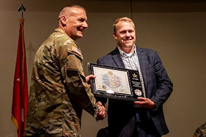 BG Porter presents the ceremonial PaYS Partnership Plaque to Mr. Tipotsch for Simon a Colas Company BG Porter presents the ceremonial PaYS Partnership Plaque to Mr. Tipotsch for Simon a Colas Company