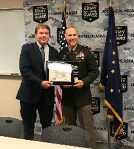 COL Brower of the AKARNG presents Mr. Anderson the PaYS Ceremonial Plaque for the Alaska Department of Transportation. COL Brower of the AKARNG presents Mr. Anderson the PaYS Ceremonial Plaque for the Alaska Department of Transportation.